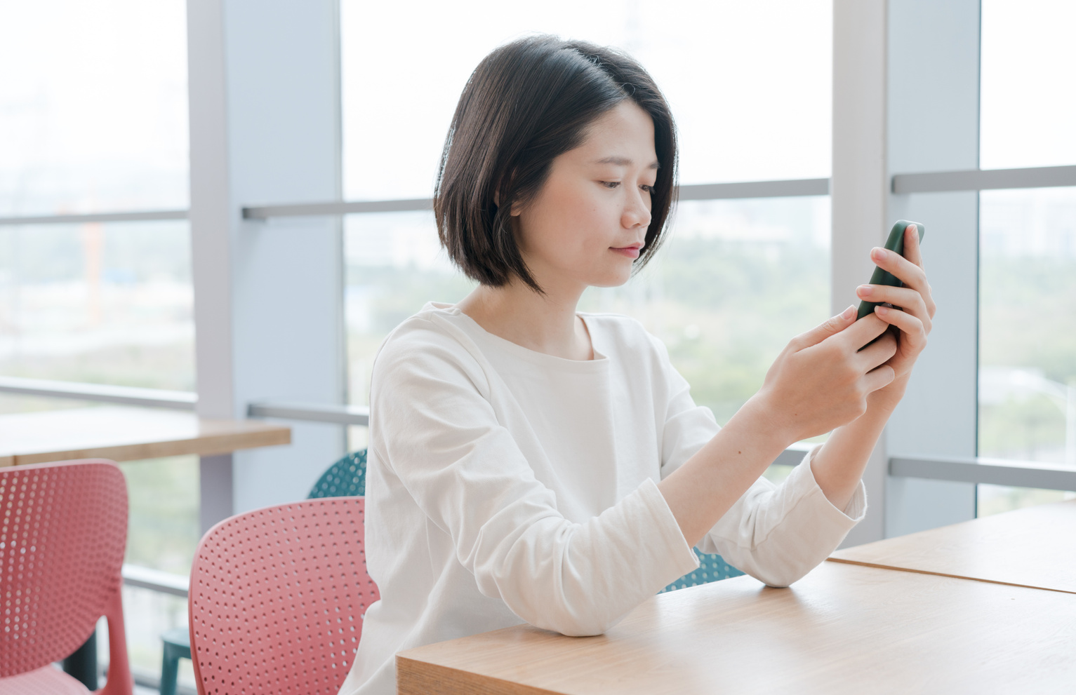 Asian female using smartphone